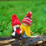 two doll wearing knit caps