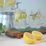 a couple of lemons sitting on top of a cutting board