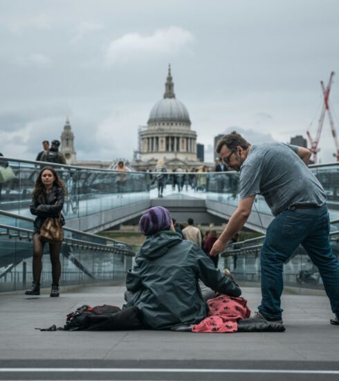 person sitting on floor near people