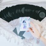 person holding printed paper
