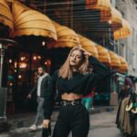 woman standing near people and building during day